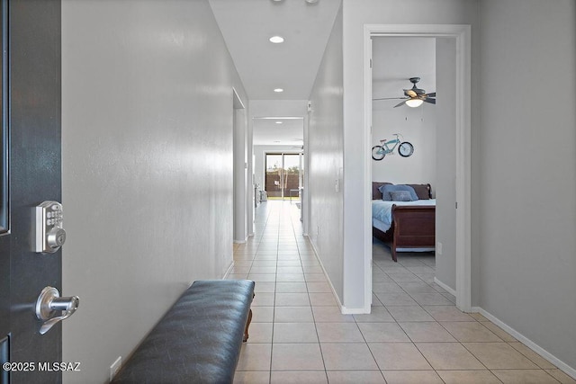 hall with light tile patterned floors