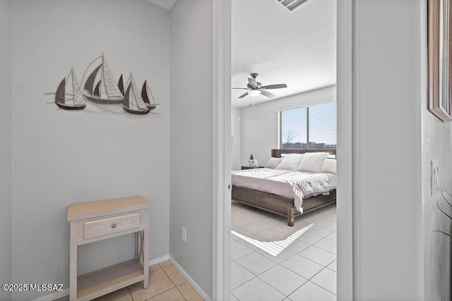 bedroom featuring ceiling fan and light tile patterned floors