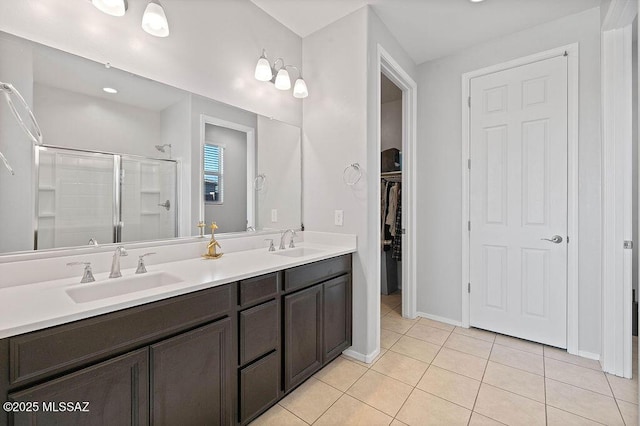 bathroom with vanity, tile patterned floors, and walk in shower