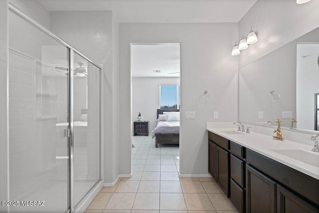 bathroom featuring vanity, an enclosed shower, and tile patterned flooring