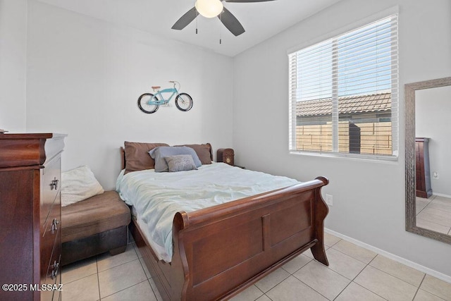 tiled bedroom featuring ceiling fan