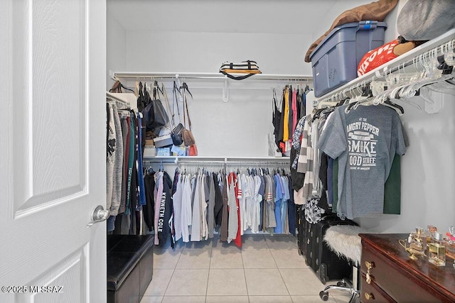 walk in closet featuring light tile patterned floors