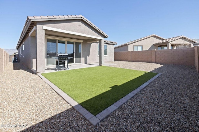 rear view of property with cooling unit, a patio area, and a lawn