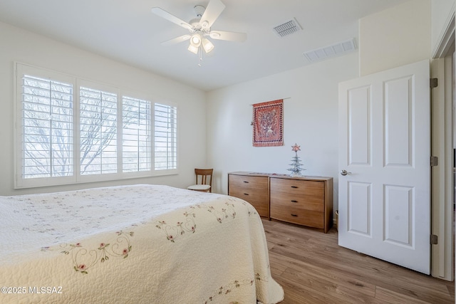 bedroom featuring hardwood / wood-style flooring and ceiling fan