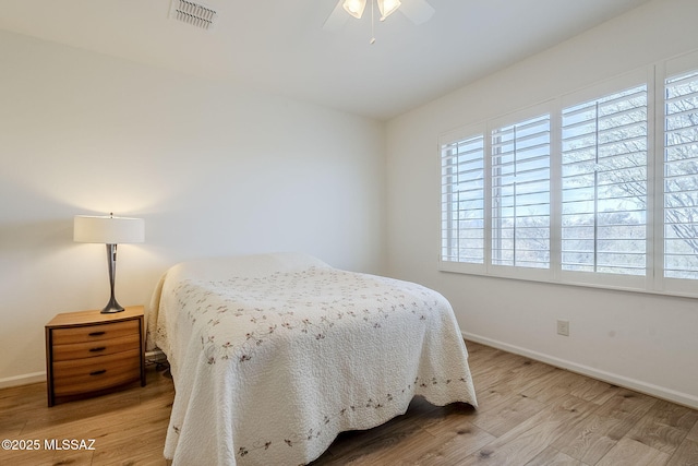 bedroom featuring ceiling fan and light wood-type flooring