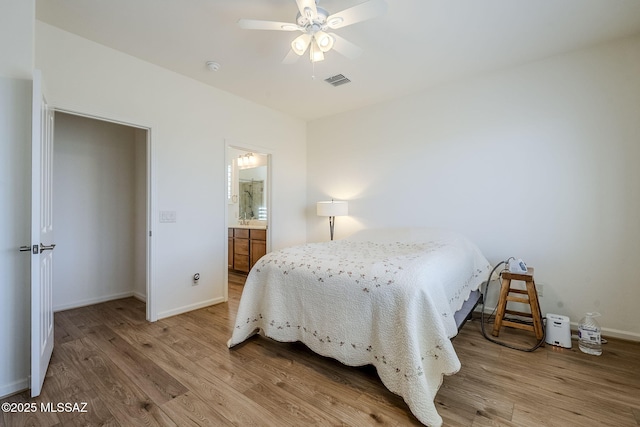 bedroom featuring ensuite bathroom, ceiling fan, and light hardwood / wood-style floors