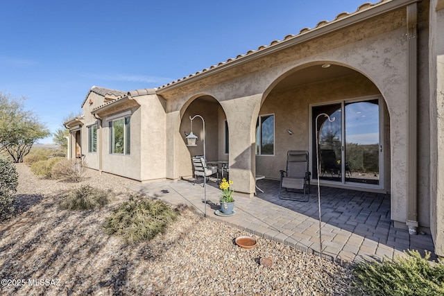 back of house with a patio