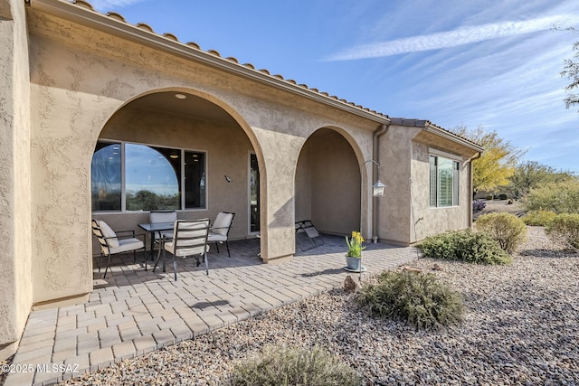 rear view of house featuring a patio area