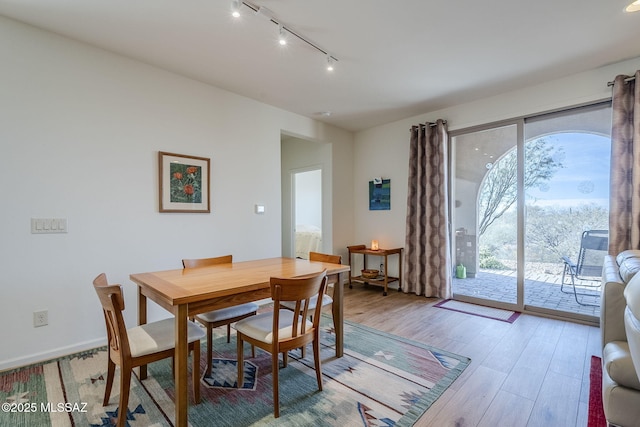 dining area with a healthy amount of sunlight and light wood-type flooring