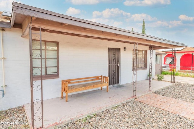 doorway to property with a patio