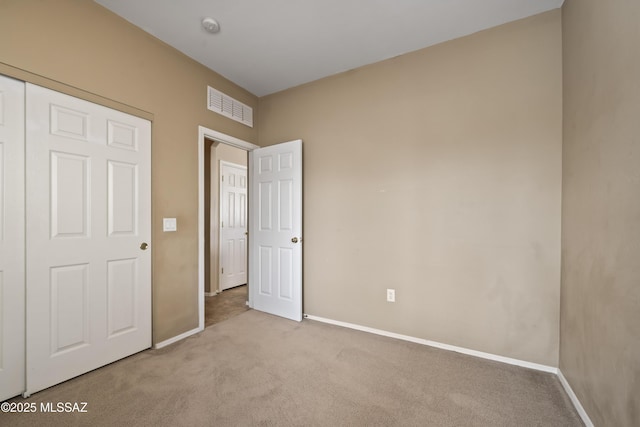 unfurnished bedroom with light carpet