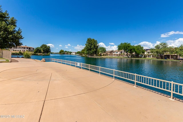 surrounding community featuring a water view