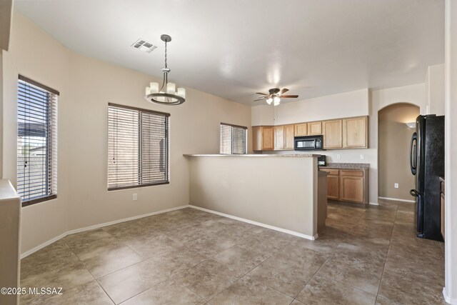 kitchen featuring tile patterned floors, kitchen peninsula, pendant lighting, ceiling fan with notable chandelier, and black appliances