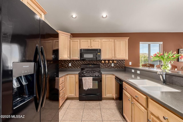 kitchen featuring black appliances, decorative backsplash, light brown cabinets, light tile patterned floors, and sink