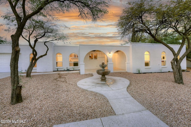 view of front of property with a garage