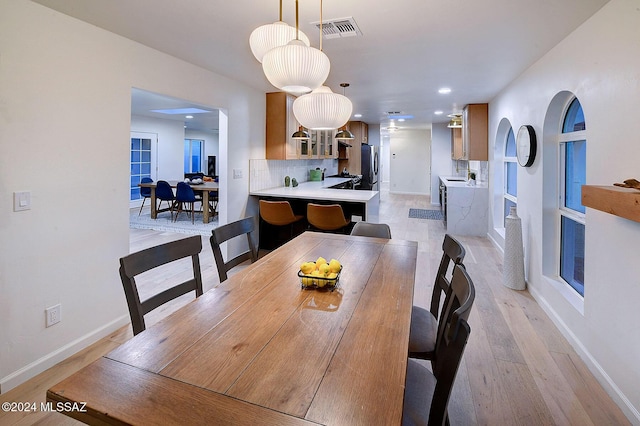 dining room featuring light wood-type flooring