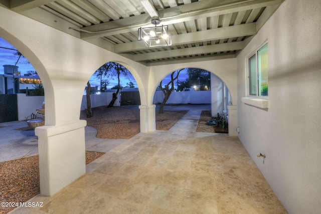 view of patio terrace at dusk