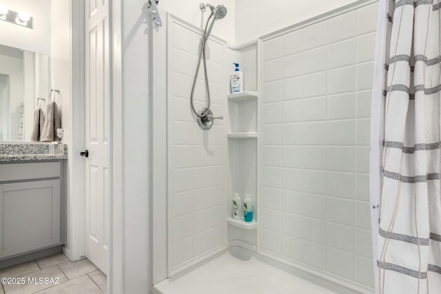 bathroom with tile patterned floors and vanity