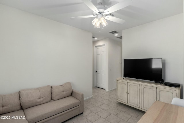 tiled living room featuring ceiling fan