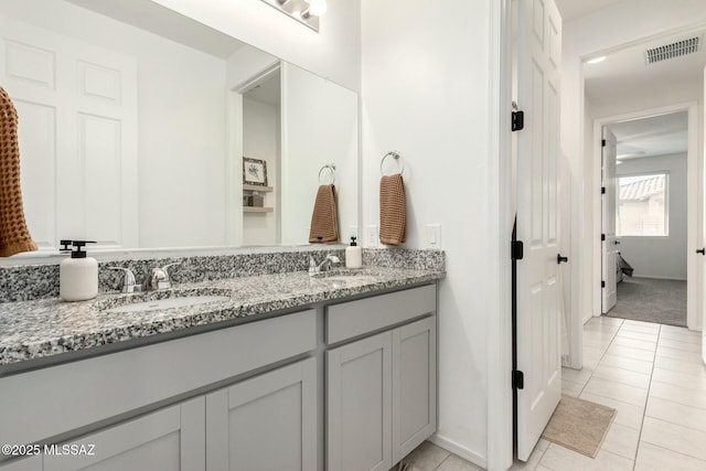 bathroom with tile patterned flooring and vanity