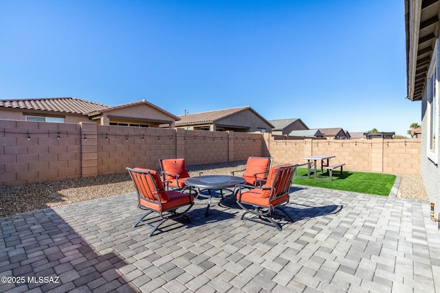 view of patio with an outdoor fire pit