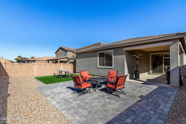 view of patio / terrace featuring a fire pit