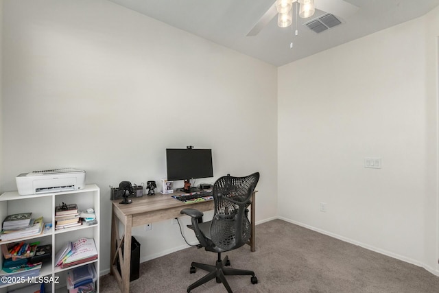 carpeted home office with ceiling fan