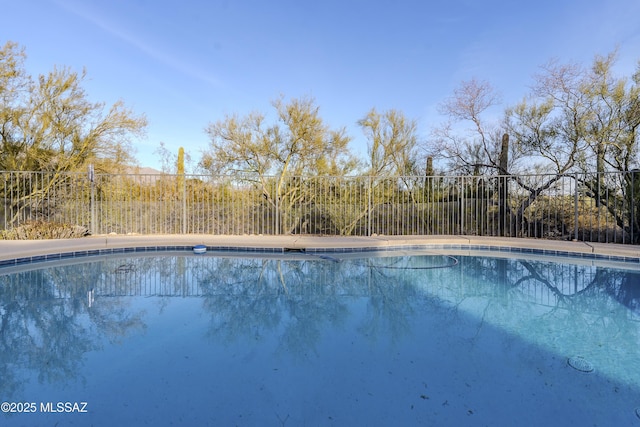 view of swimming pool featuring a fenced in pool and fence