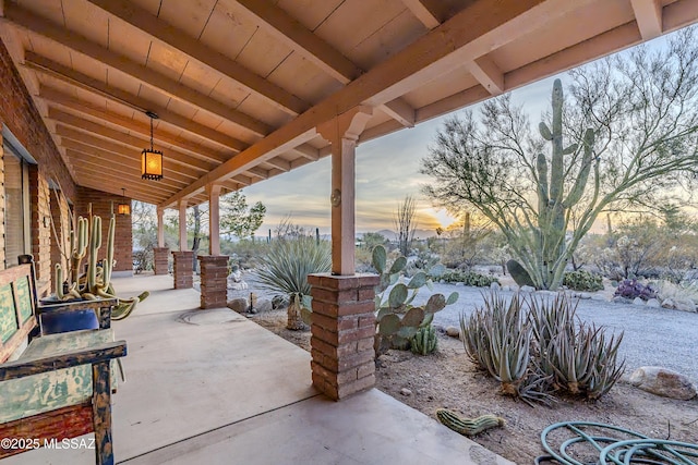 view of patio terrace at dusk