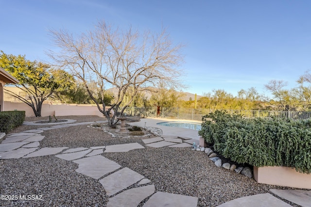 view of yard with a patio area, a fenced in pool, and fence private yard