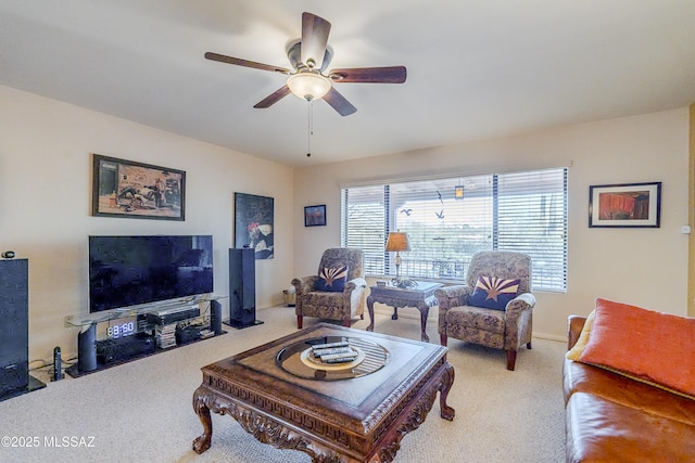 carpeted living room featuring ceiling fan