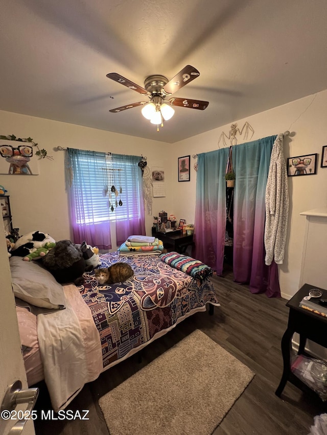 bedroom featuring ceiling fan and dark wood-type flooring