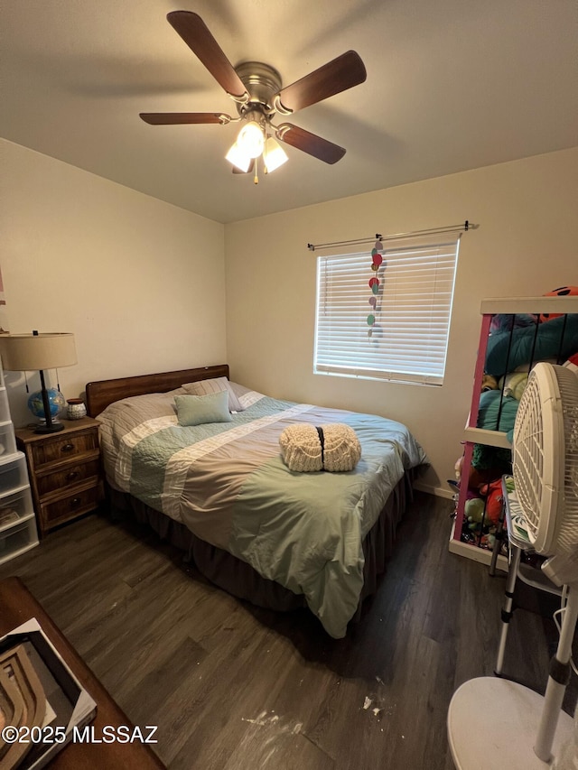 bedroom with ceiling fan and dark wood-type flooring