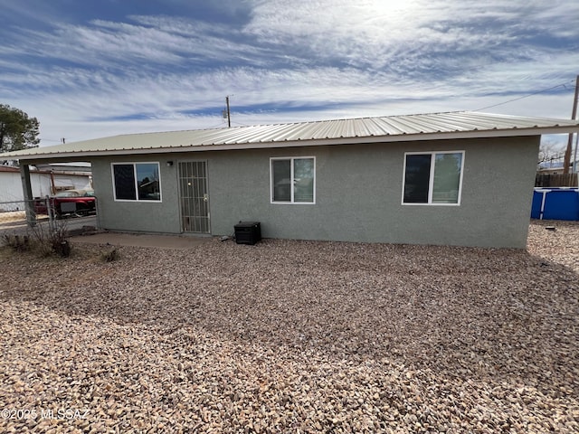 back of property featuring a patio area