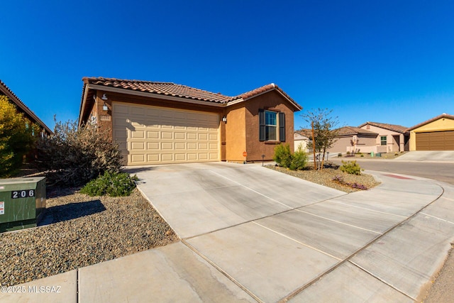 ranch-style home featuring concrete driveway, stucco siding, a tiled roof, and an attached garage