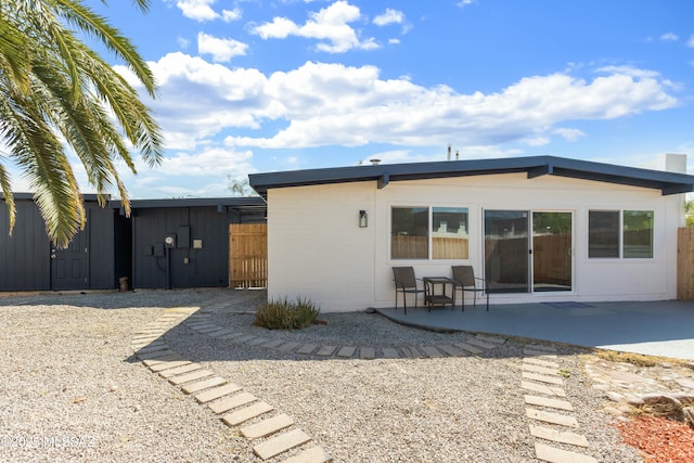 rear view of property with a patio