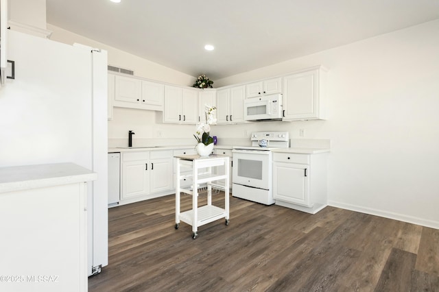 kitchen featuring white cabinetry, white appliances, and dark hardwood / wood-style flooring