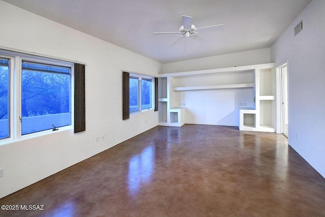 972 N Rancho Del Jefe Loop, Tucson, AZ 85748 - unfurnished living room featuring finished concrete flooring, built in features, and ceiling fan