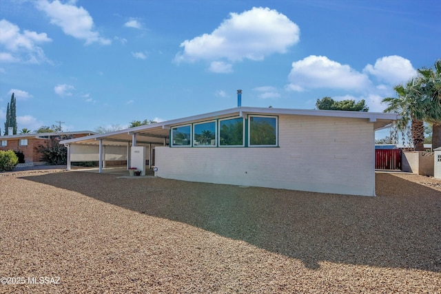 exterior space with a carport