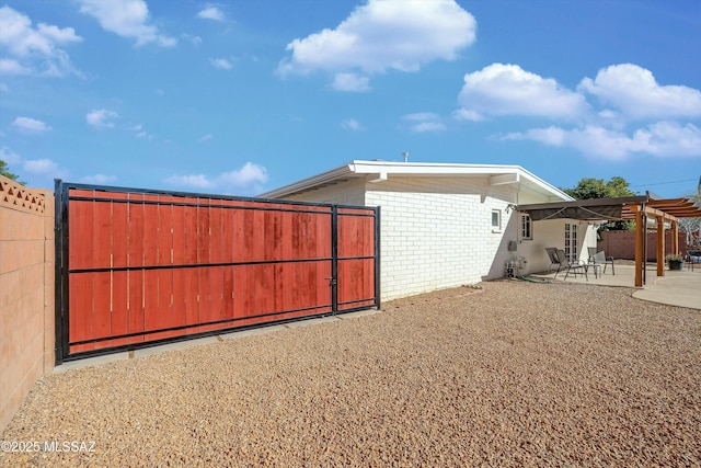 back of house with a patio and a pergola