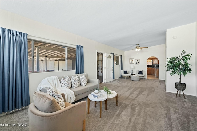 carpeted living room featuring ceiling fan