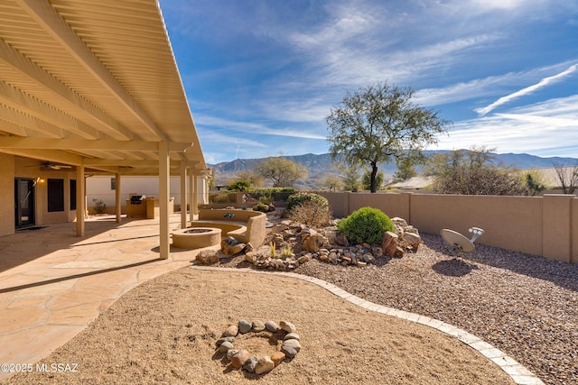 view of yard featuring a mountain view and a patio area