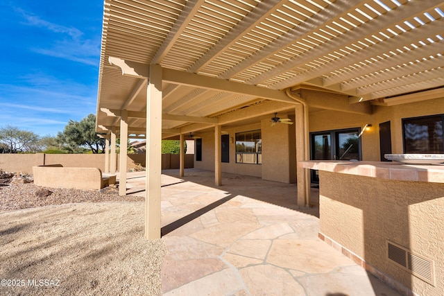 view of patio / terrace with a pergola and ceiling fan