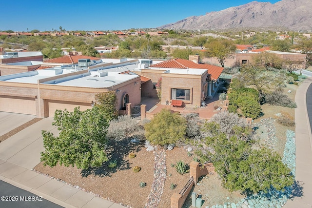 birds eye view of property with a mountain view