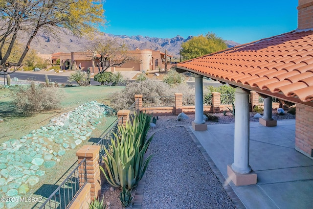 view of patio / terrace featuring a mountain view