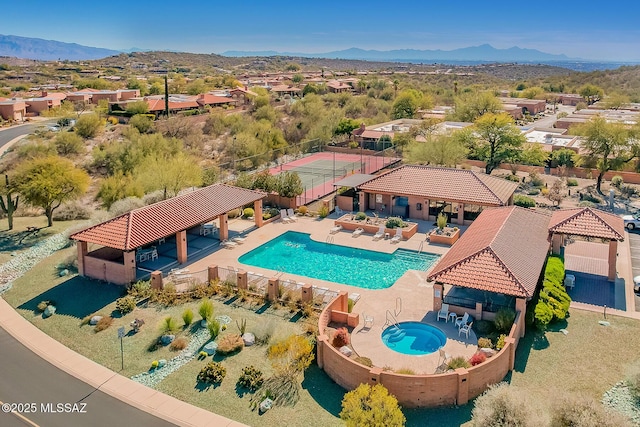 view of swimming pool with a gazebo, a mountain view, and a patio area