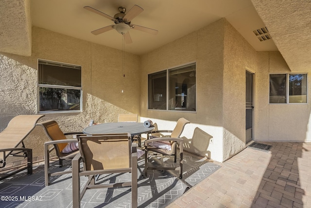 view of patio / terrace featuring ceiling fan