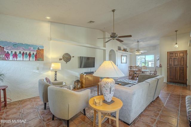 living room featuring lofted ceiling and tile patterned floors