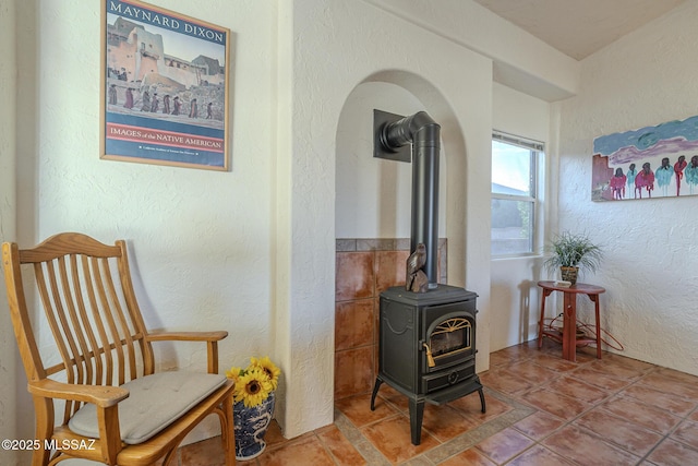 living area featuring a wood stove