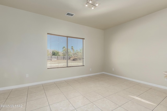 empty room with light tile patterned flooring